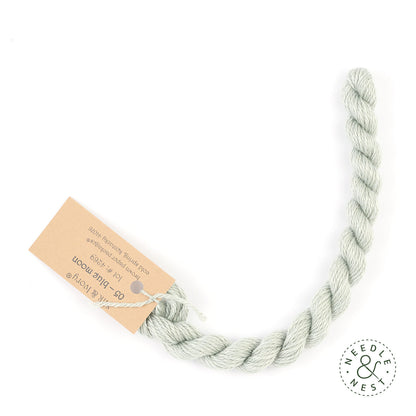 Silk & Ivory Blue Moon Thread on a White Background