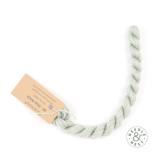 Silk & Ivory Blue Moon Thread on a White Background