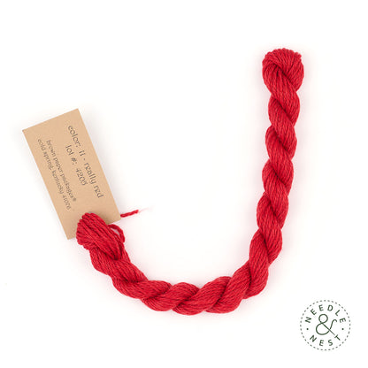 Silk & Ivory Really Red Thread on a White Background