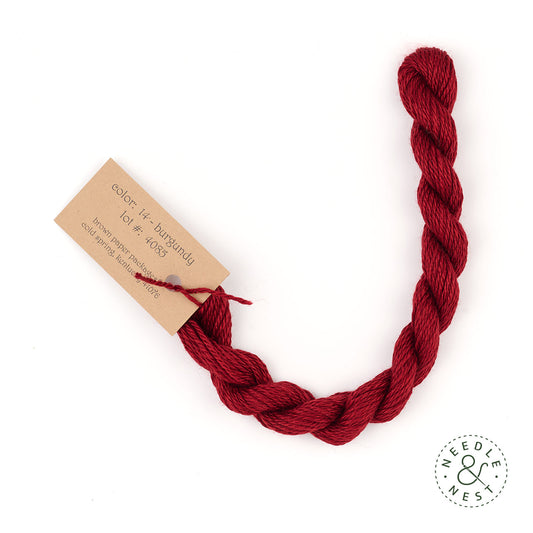 Silk & Ivory Burgundy Thread on a White Background
