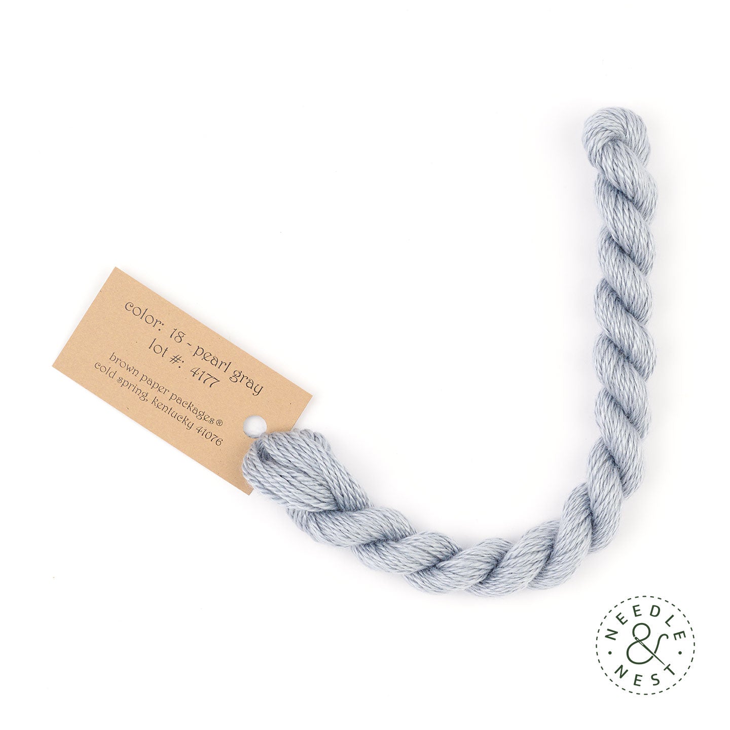 Silk & Ivory Pearl Gray Thread on a White Background