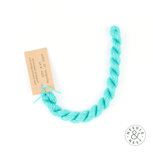 Silk & Ivory Turquoise Thread on a White Background