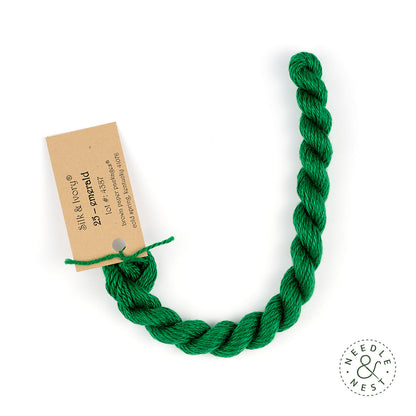 Silk & Ivory Emerald Thread on a White Background