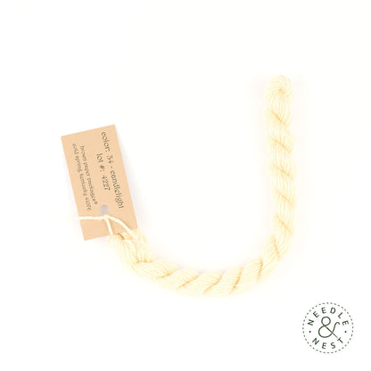 Silk & Ivory Candlelight Thread on a White Background