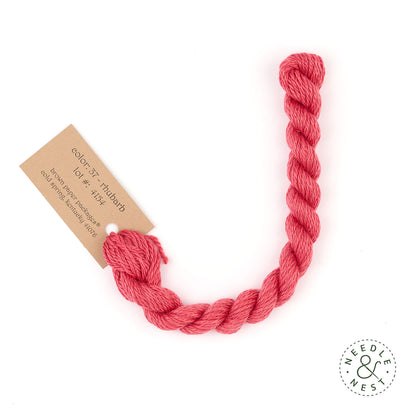 Silk & Ivory Rhubarb Thread on a White Background