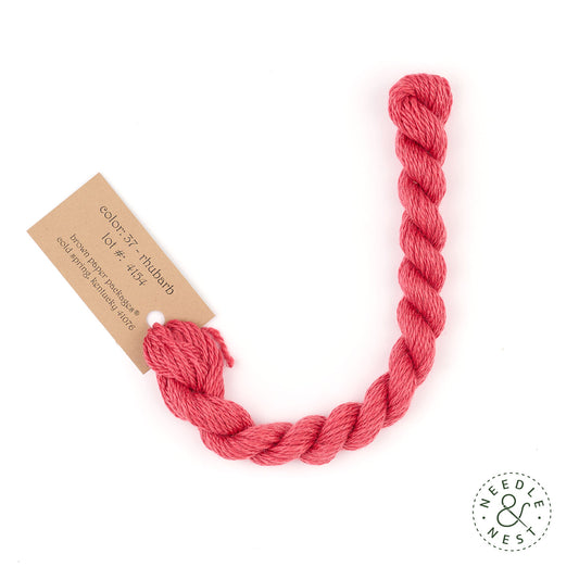 Silk & Ivory Rhubarb Thread on a White Background