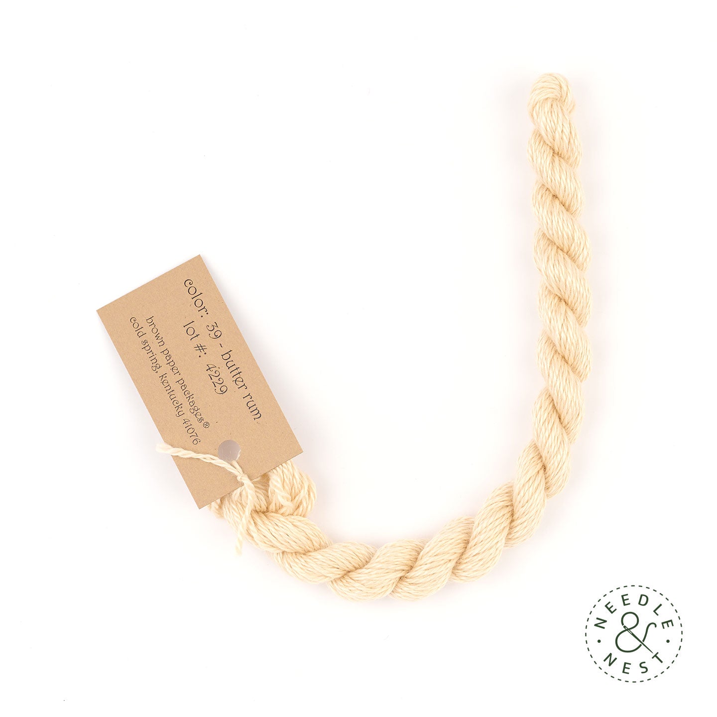 Silk & Ivory Butter Rum Thread on a White Background