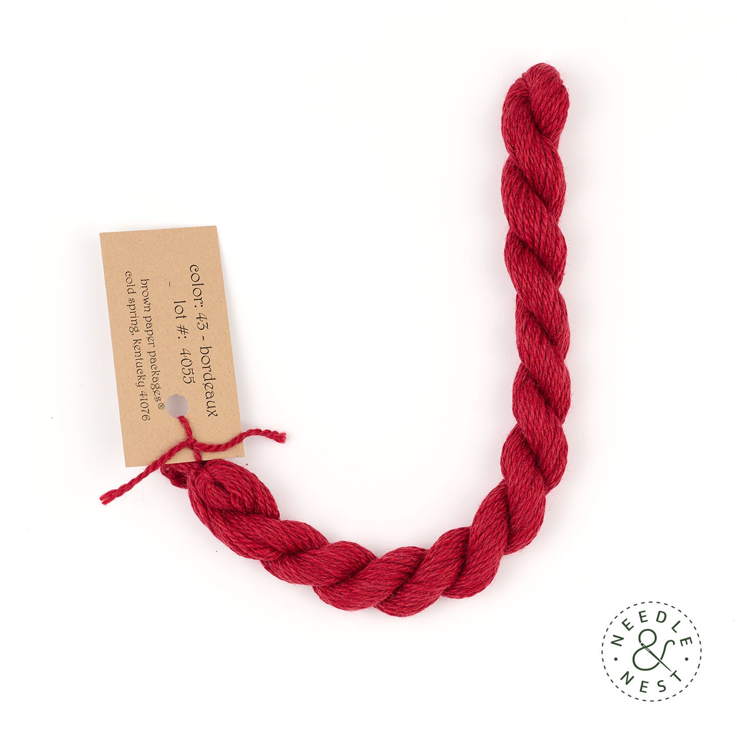 Silk & Ivory Bordeaux Thread on a White Background