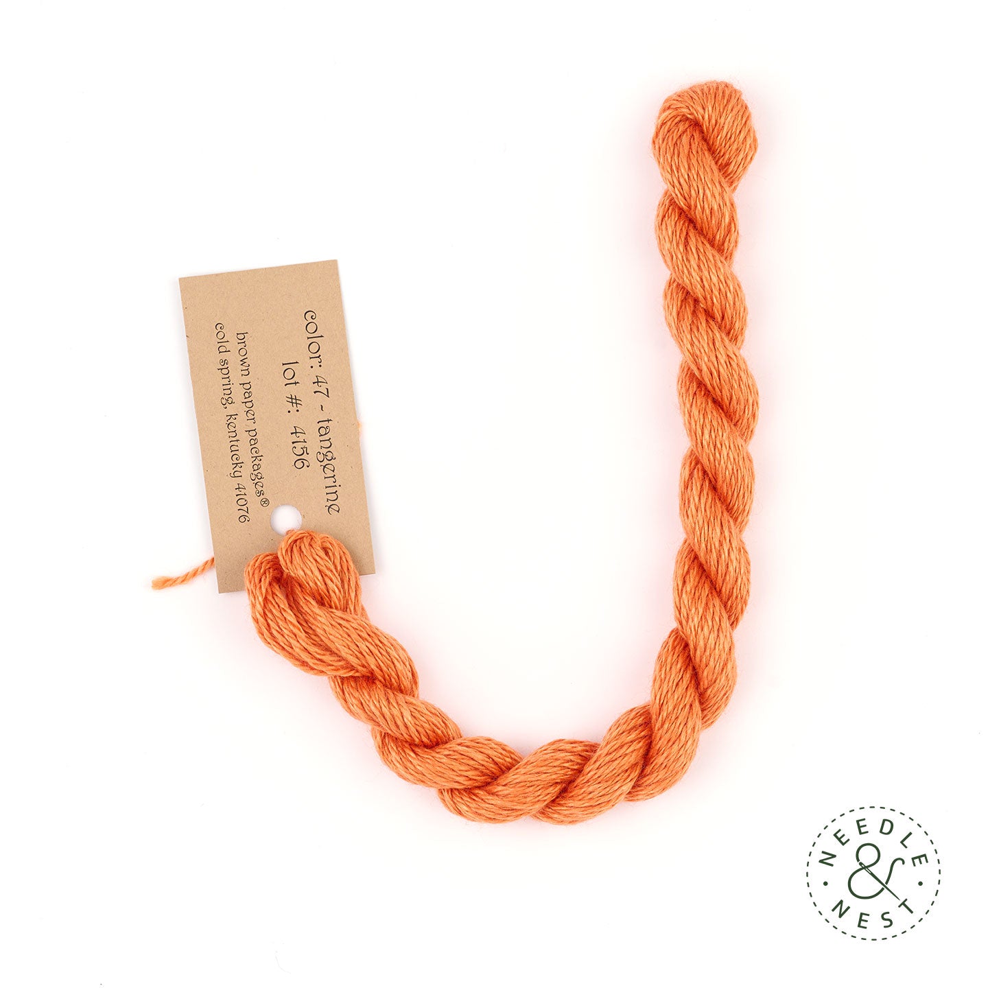 Silk & Ivory Tangerine Thread on a White Background