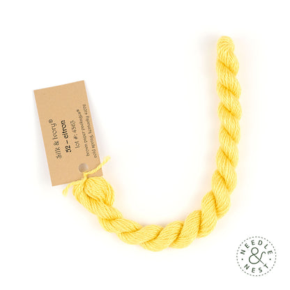 Silk & Ivory Citron Thread on a White Background