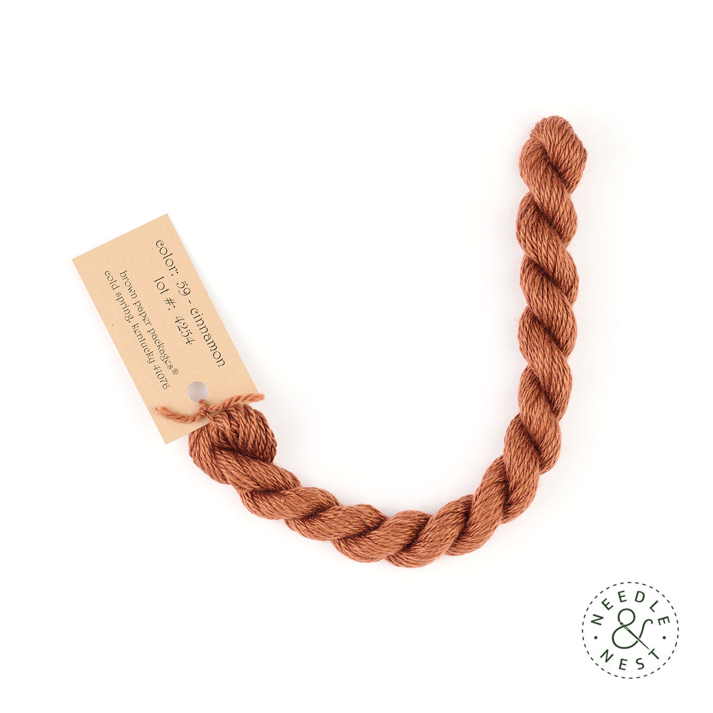 Silk & Ivory Cinnamon Thread on a White Background