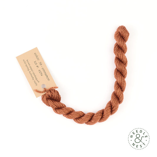 Silk & Ivory Cinnamon Thread on a White Background
