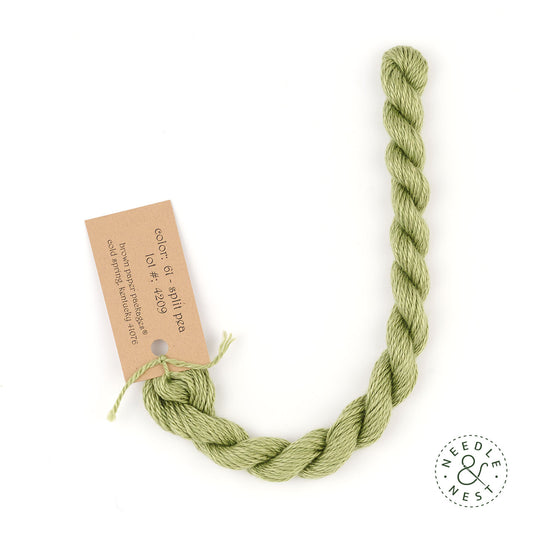 Silk & Ivory Split Pea Thread on a White Background