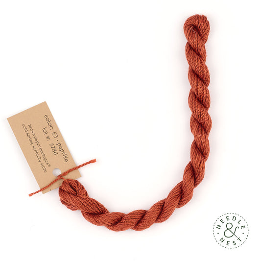 Silk & Ivory Paprika Thread on a White Background
