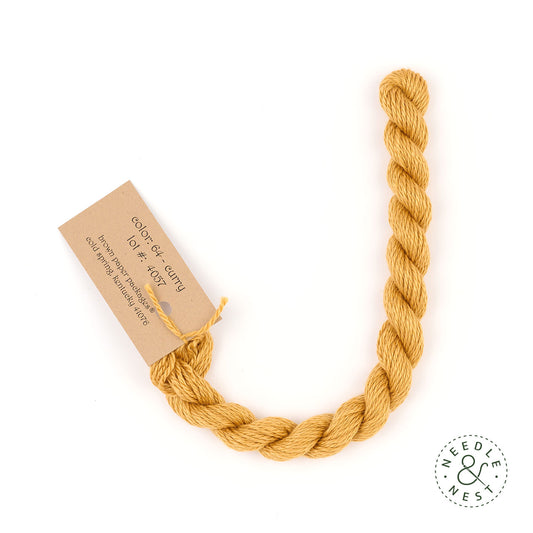 Silk & Ivory Curry Thread on a White Background
