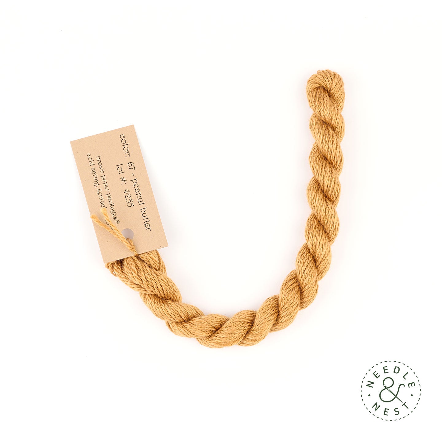 Silk & Ivory Peanut Butter Thread on a White Background