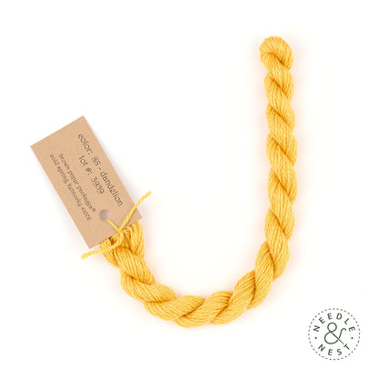 Silk & Ivory Dandelion Thread on a White Background