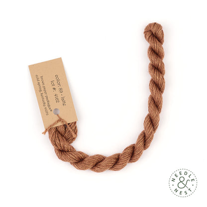 Silk & Ivory Latte Thread on a White Background