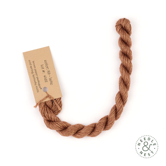 Silk & Ivory Latte Thread on a White Background