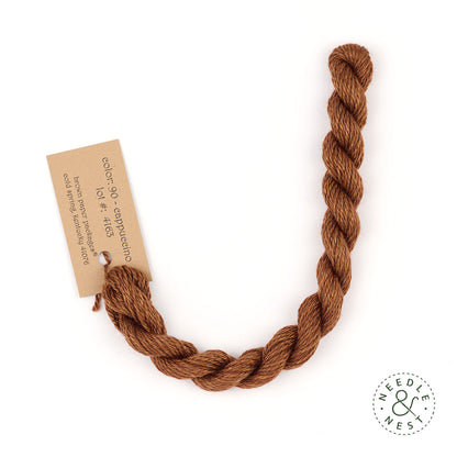 Silk & Ivory Cappuccino Thread on a White Background