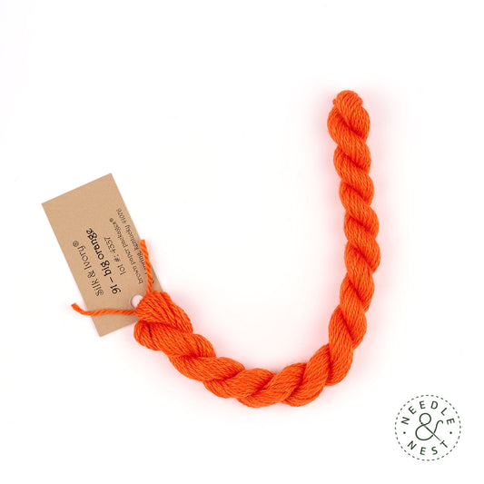 Silk & Ivory Big Orange Thread on a White Background