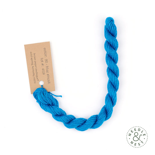 Silk & Ivory Blue Streak Thread on a White Background