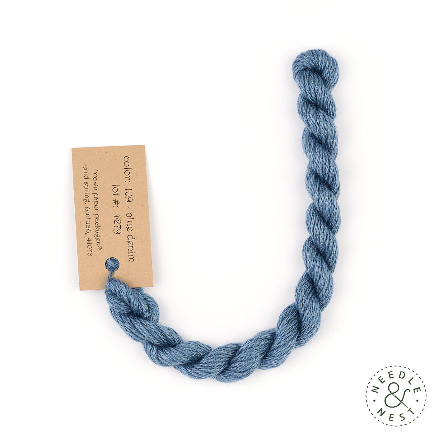 Silk & Ivory Blue Denim Thread on a White Background