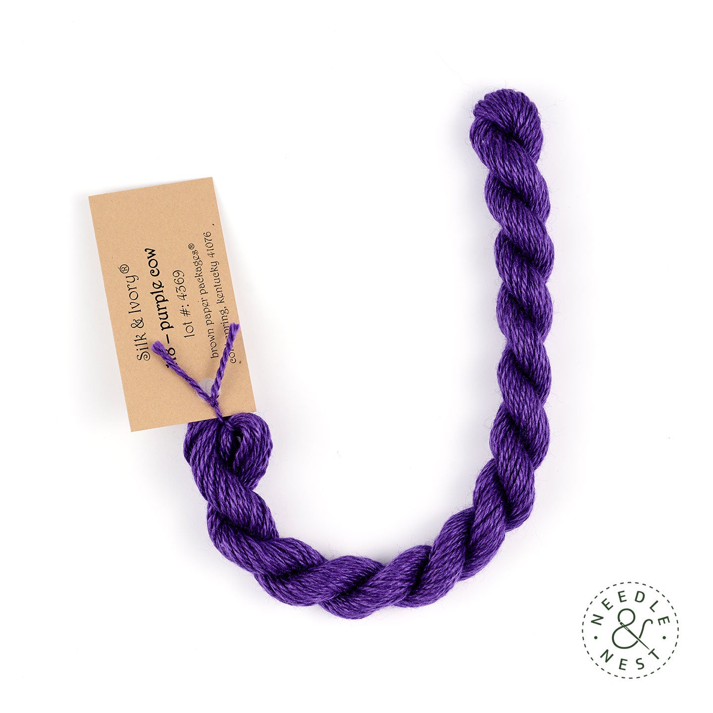 Silk & Ivory Purple Cow Thread on a White Background