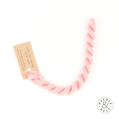 Silk & Ivory Shrimp Thread on a White Background