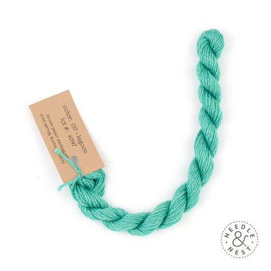 Silk & Ivory Lagoon Thread on a White Background
