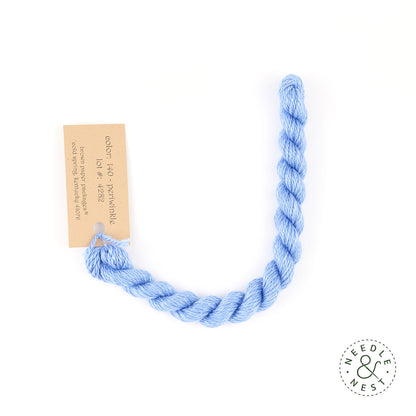 Silk & Ivory Periwinkle Thread on a White Background
