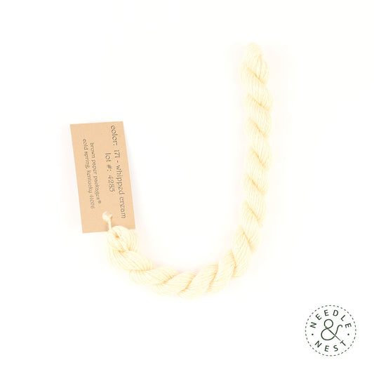 Silk & Ivory Whipped Cream Thread on a White Background