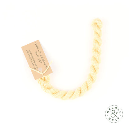 Silk & Ivory French Vanilla Thread on a White Background