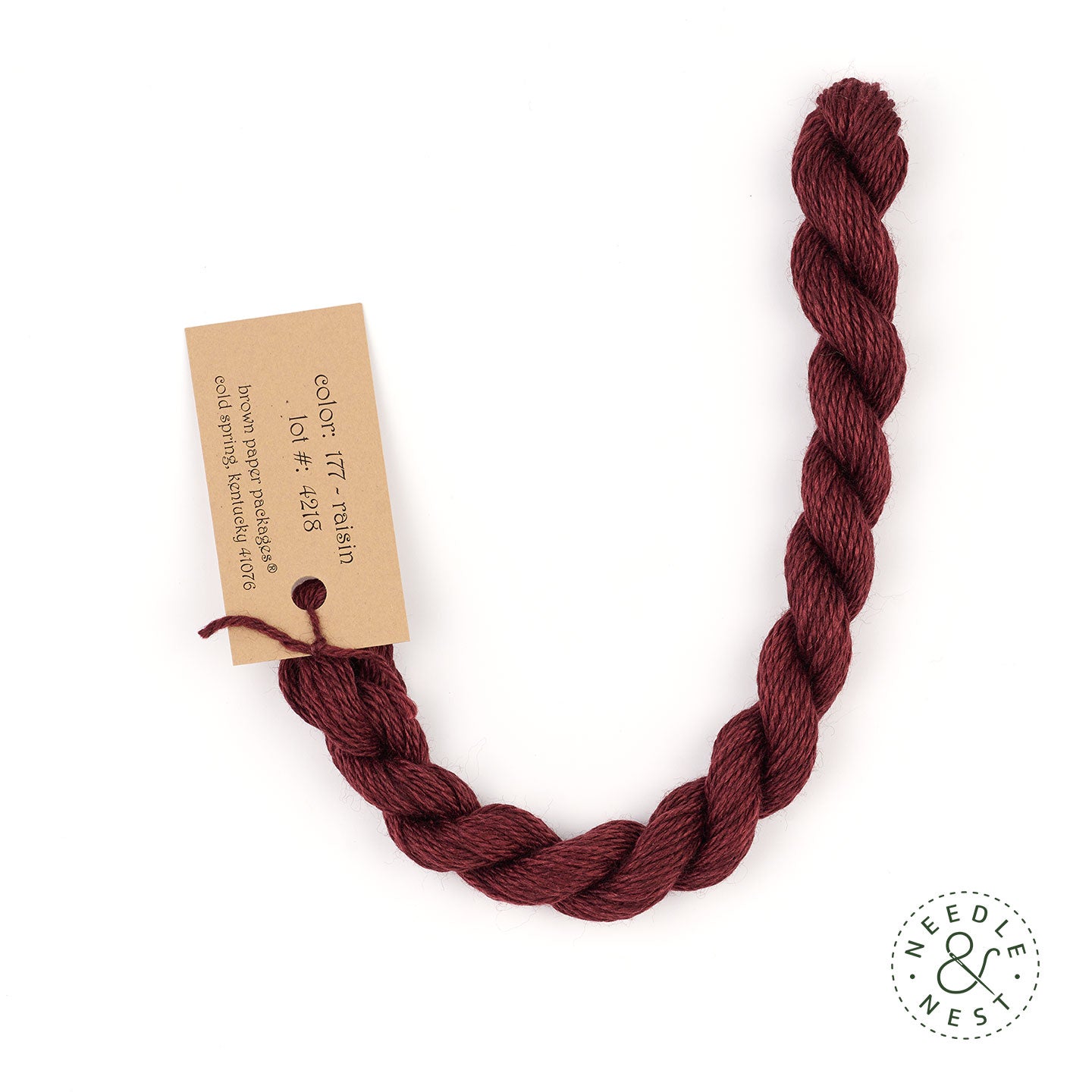 Silk & Ivory Raisin Thread on a White Background