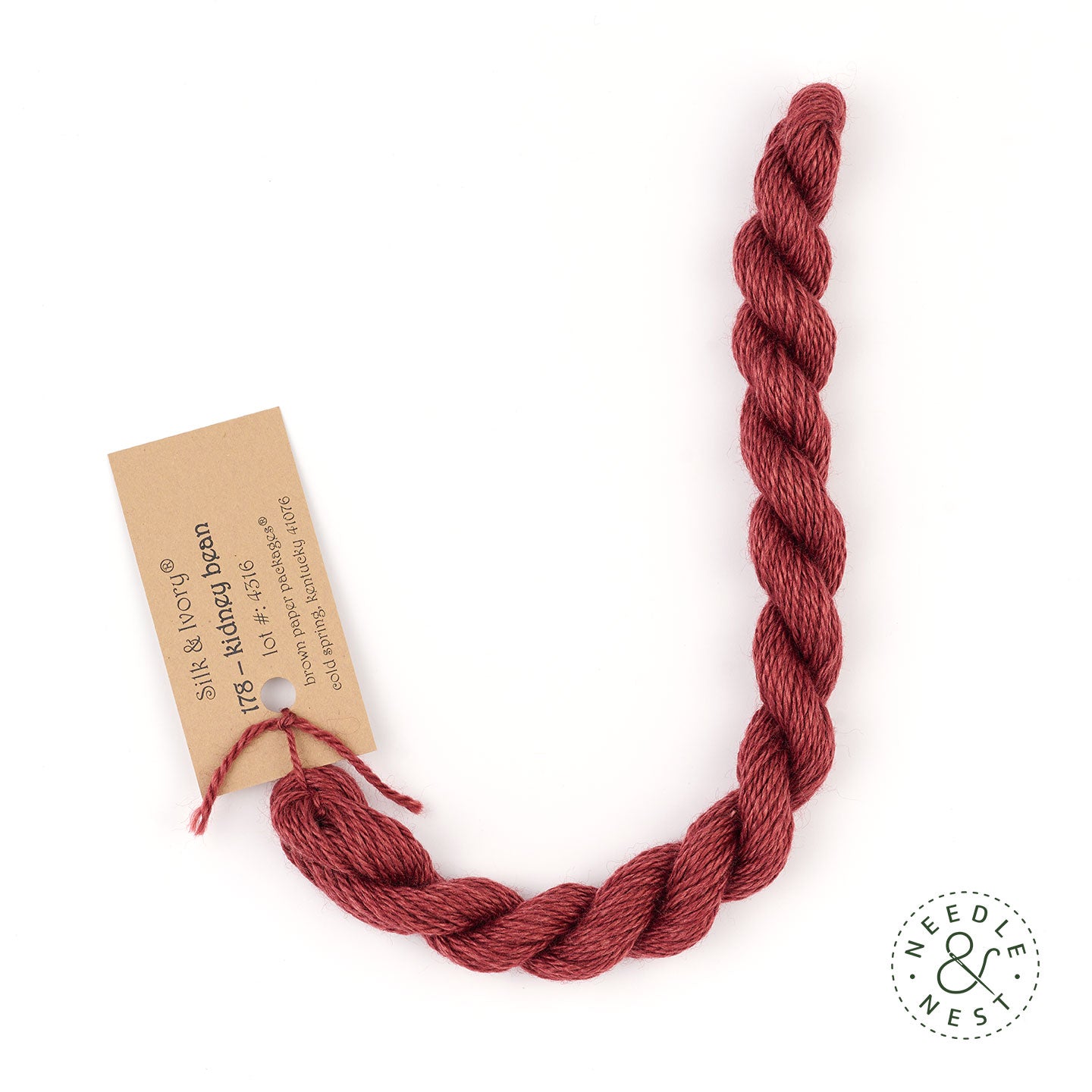 Silk & Ivory Kidney Bean Thread on a White Background