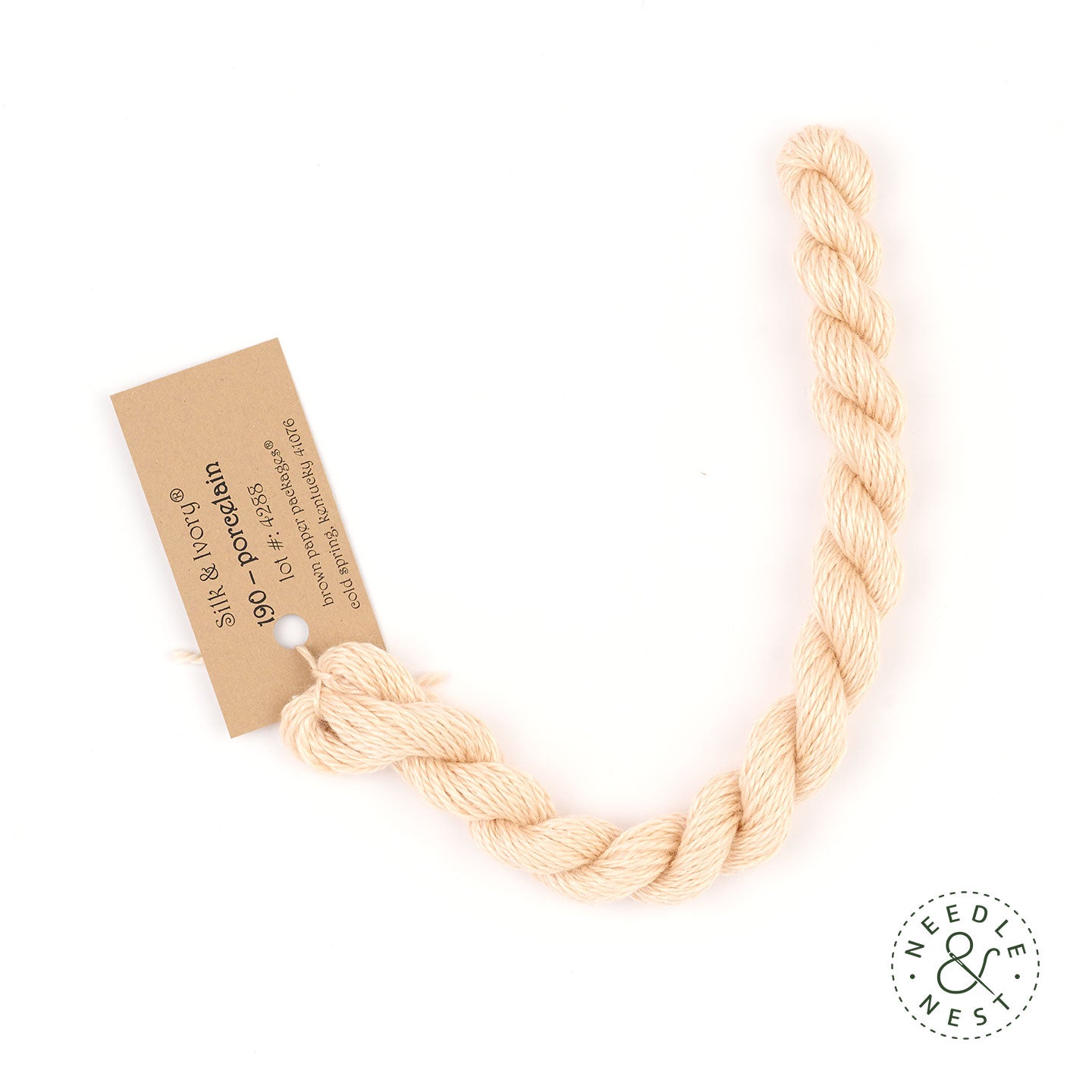 Silk & Ivory Porcelain Thread on a White Background