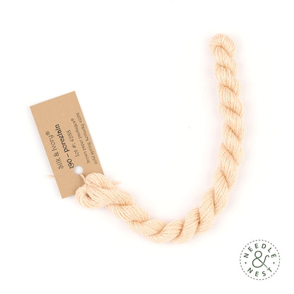 Silk & Ivory Porcelain Thread on a White Background