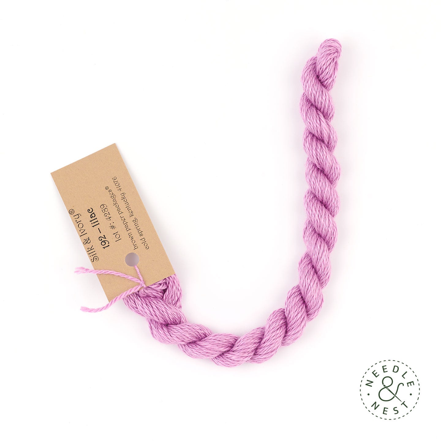 Silk & Ivory Lilac Thread on a White Background