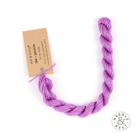 Silk & Ivory Petunia Thread on a White Background