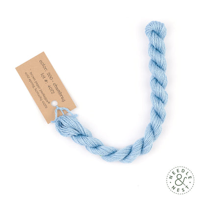 Silk & Ivory Chambray Thread on a White Background