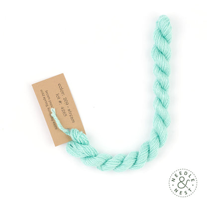Silk & Ivory Stream Thread on a White Background