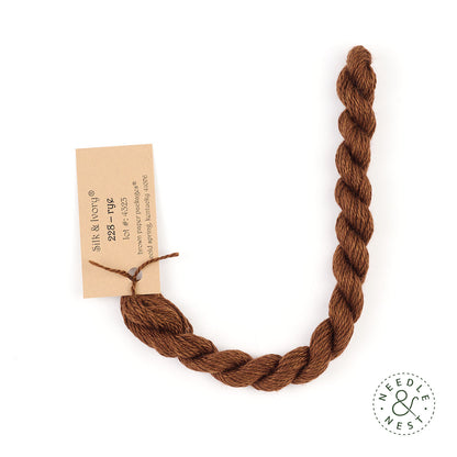 Silk & Ivory Rye Thread on a White Background