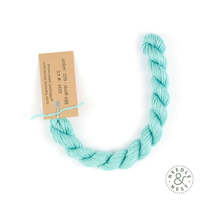 Silk & Ivory Duck Egg Thread on a White Background