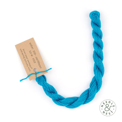 Silk & Ivory Caribbean Thread on a White Background